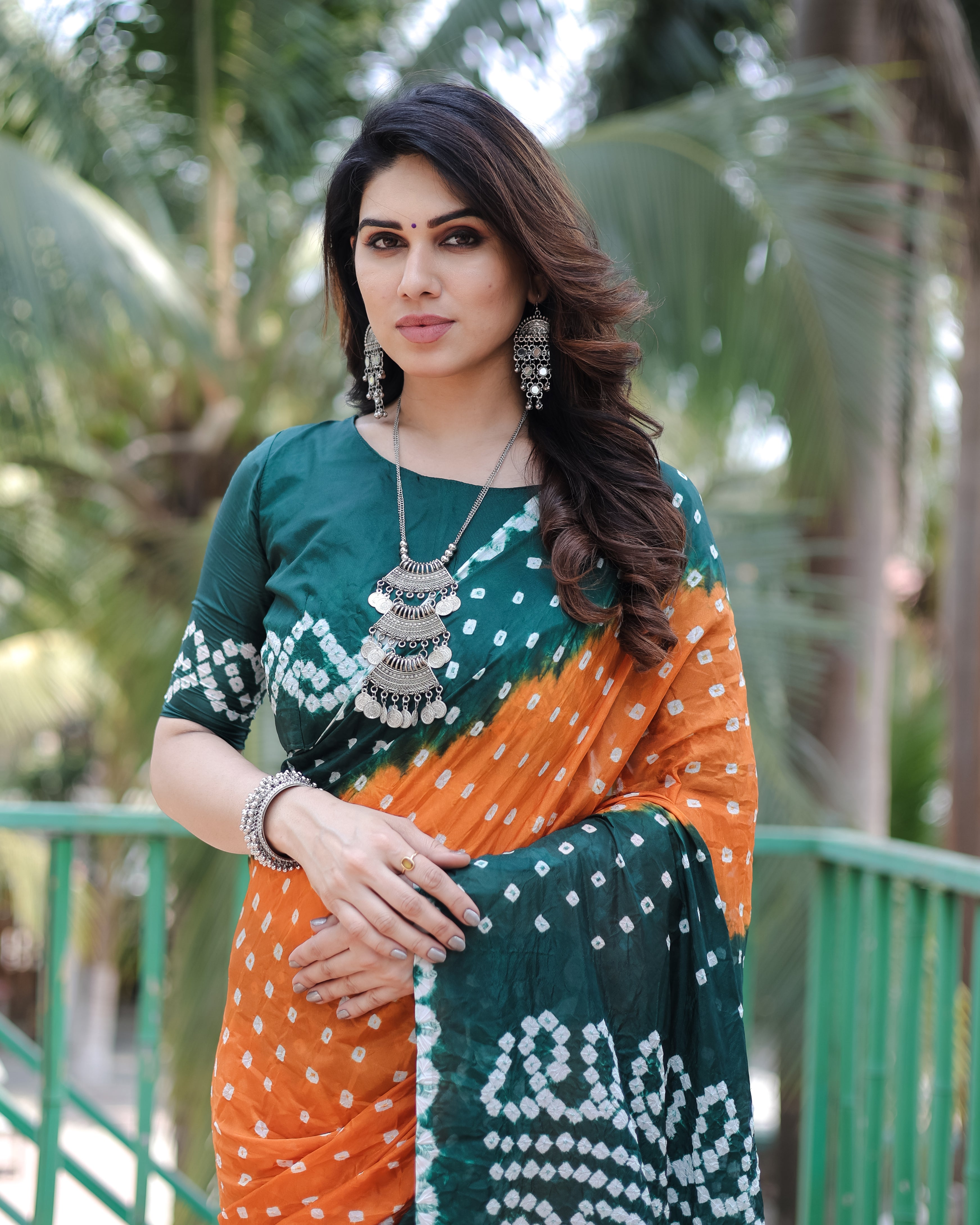 New Premium And High Quality Comfortable Bandhej Silk Drapes That is Super Stylish And Pretty Orange And Green Saree