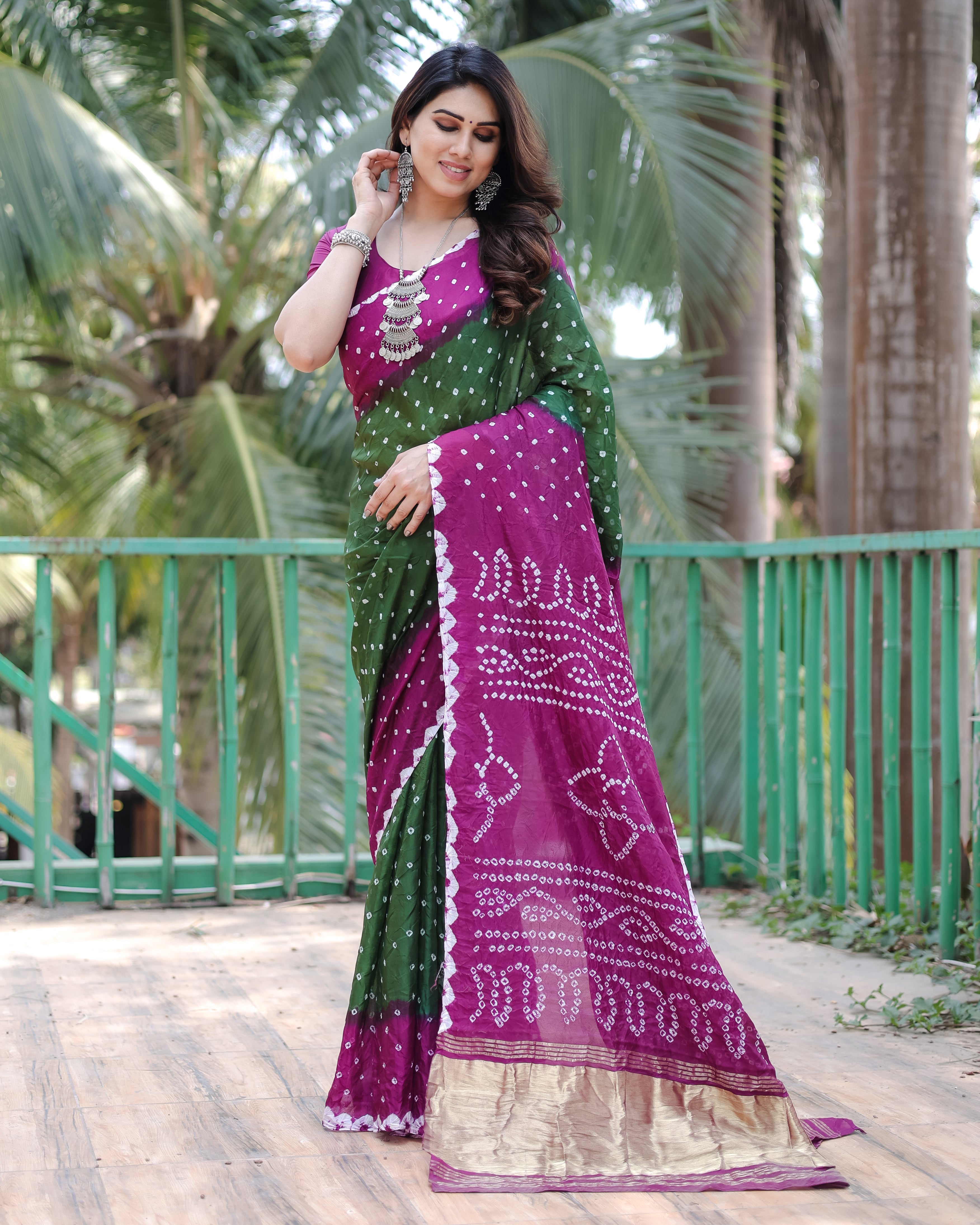 New Premium And High Quality Comfortable Bandhej Silk Drapes That is Super Stylish And Pretty Green And Purple Saree